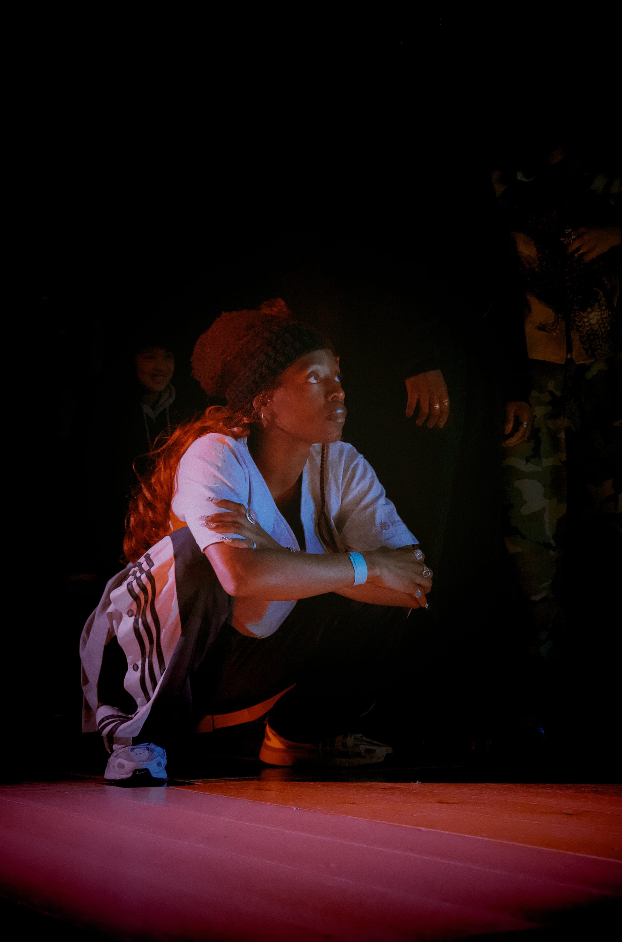 Dancer is crouching and watching the battles.